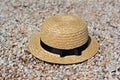 Straw hat on sand, sun protection concept. Women`s beach accessories or summer outfit Royalty Free Stock Photo