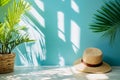 A straw hat sitting on top of a table next to a plant Royalty Free Stock Photo