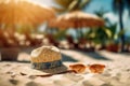 Straw hat, sunglasses on the beach sand against the background of straw umbrellas, tropical palm trees, sea or ocean. Summer