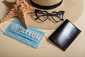 Straw hat sunglasses in the shape of a heart, passport, starfish and mask with the inscription vacation. Vacation