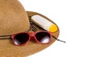 Straw hat with sunglasses and sun lotion Royalty Free Stock Photo