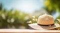 A straw hat on the table in the sunshine. Vacation concept, summer feelings. Generative AI Royalty Free Stock Photo