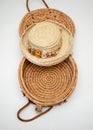 Straw hat trimmed in dried flowers on top of woven basket