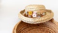 Straw hat trimmed in fried flowers on basket