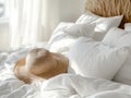 Straw Hat On White Bedding In Bedroom Setting Royalty Free Stock Photo