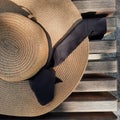Straw hat on a bench somewhere in the city Royalty Free Stock Photo