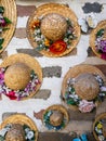 Straw hats with flowers decorating brick house walls in Ikseondong Hanok village in Seoul Royalty Free Stock Photo