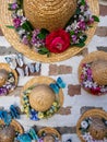 Straw hats with flowers decorating brick house walls in Ikseondong Hanok village in Seoul Royalty Free Stock Photo