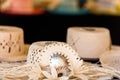 Straw hats for sale in a tropical souvenir shop in Aitutaki, Cook Islands. With selective focus