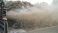 Straw or Husk storm closeup. Blowing husk straw in air from thresher machine