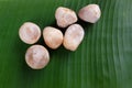 Top viewstraw mushroom isolated on green banana leaf background Royalty Free Stock Photo