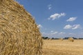 Straw roll bales detail with crop field, photovoltaic panel and blue sky in background Royalty Free Stock Photo