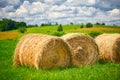 Straw roll on a green field with a beautiful sky Royalty Free Stock Photo