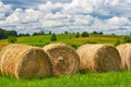 Straw roll on a green field with a beautiful sky Royalty Free Stock Photo