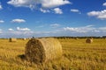 Straw rolls on farmer field in the summer Royalty Free Stock Photo