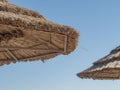 Straw Roof Of Beach Umbrella And Blue Sky In Background. Beach Vacation And Travel Concept Royalty Free Stock Photo