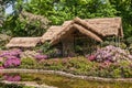 Straw roof gazebo over flowers at Humble Administrators garden, Suzhou, China