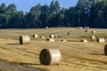 Straw stack after harvesting grain in the field Royalty Free Stock Photo