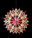 Straw star Christmas decoration over black