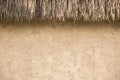 straw thatched roof and soil wall background Royalty Free Stock Photo