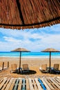 A straw umbrella on a beautiful tropical beach Royalty Free Stock Photo