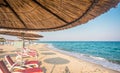 Umbrella and sunbeds no people on Marmari beach, Kos, Greece