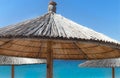 Straw Umbrella on sunny beach