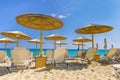 Straw umbrellas on beach