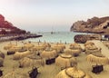 Straw umbrellas on the beach in Port de Pollenca Puerto Pollensa