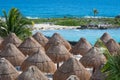 Straw umbrellas on beautiful sunny beach by the turquoise sea, ocean