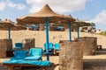 Straw umbrellas and deck chairs in a Red Sea beach - Marsa Alam Egypt Africa Royalty Free Stock Photo