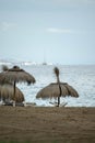 Straw umbrellas and hammocks on the sand on the beach Royalty Free Stock Photo