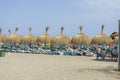 straw umbrellas on the shore of sea Marbella, Andalucia Spain