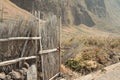 A straw and wood fence with a gate near countryside fields Madeira, Portugal,Europe Royalty Free Stock Photo