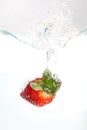 Strawberri splashing into water