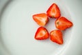 Strawberries arrange to star form on white plate Royalty Free Stock Photo