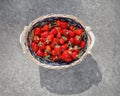 Strawberries basket on gray concrete background Royalty Free Stock Photo