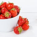 Strawberries berries fruits strawberry berry fruit in a bowl on wooden board square Royalty Free Stock Photo