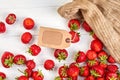 Strawberries and blank price tag. Royalty Free Stock Photo