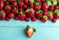 Strawberries on a blue table above view. Fruits flat lay image Royalty Free Stock Photo