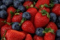 Strawberries with blueberries, top view. Close up background. Royalty Free Stock Photo
