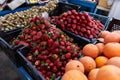 Strawberries in a box on the counter of the authentic Egyptian market. Fresh fruits in the street bazaar