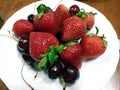Strawberries and cherry plate fresh and delicious Royalty Free Stock Photo