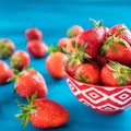 strawberries in a colorful bowl on a colorful background Royalty Free Stock Photo