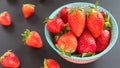 Strawberries in a colorful bowl on a colorful background Royalty Free Stock Photo