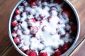Strawberries coveren with sugar. Jam making process