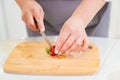 strawberries are cut into pieces on a wooden cutting board to decorate desserts. Royalty Free Stock Photo