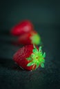 Strawberries on dark background with water drops Royalty Free Stock Photo