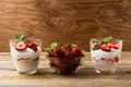 Strawberries dessert with whipped cream on rustic wooden background Royalty Free Stock Photo