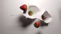 Strawberries fall into white yogurt Royalty Free Stock Photo